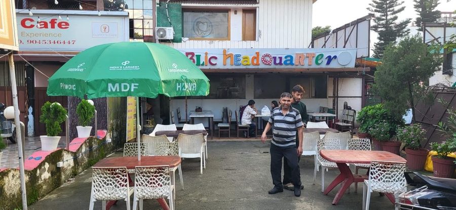 Greenpanel branded umbrella outside a café, Dehradun